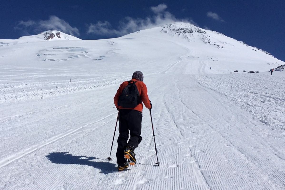 06B Jerome Ryan Climbing To Pastukhov Rocks With Mount Elbrus West And East Summits Above